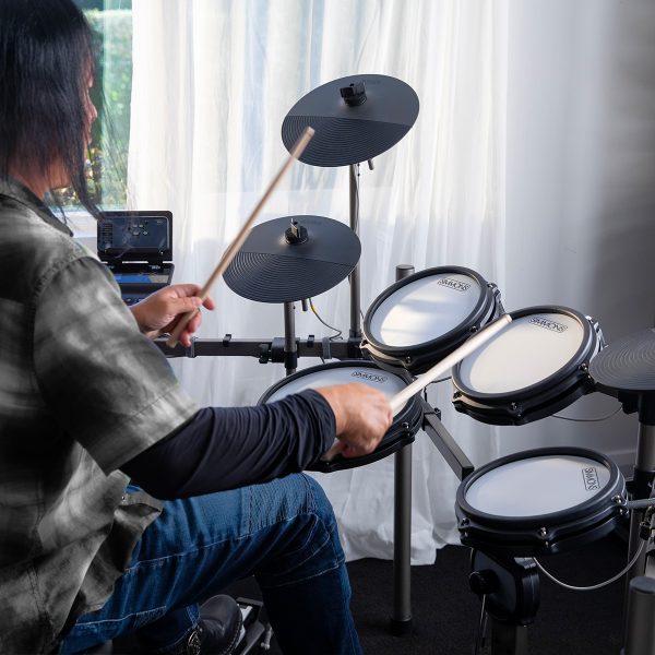 drummer playing in Titan 50 electronic drum kit in room