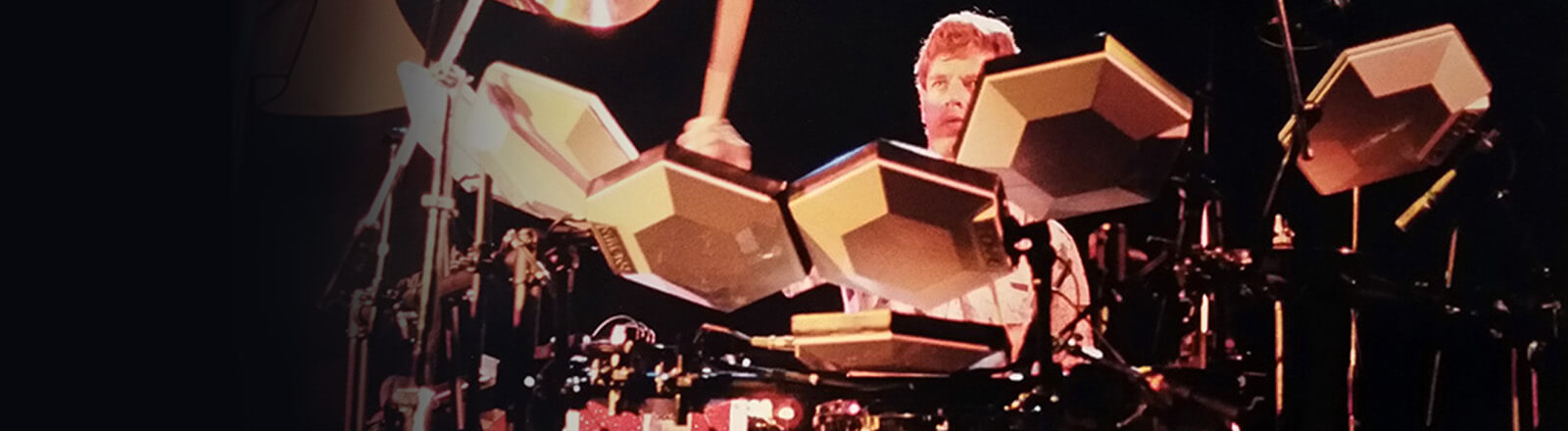 man playing Simmons vintage drum kits
