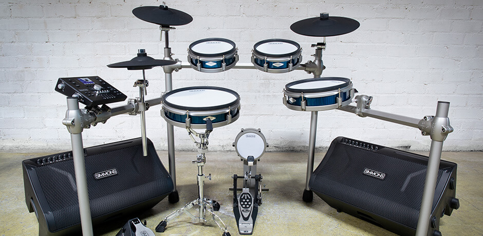 Simmons electronic drum kit and DA2112 amplifiers in an empty room