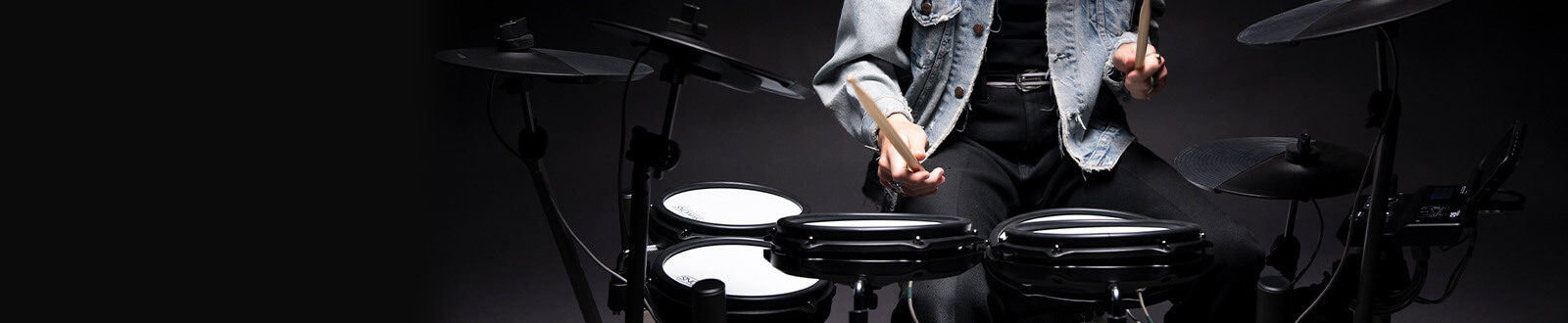 drummer playing the Titan 50 electronic drum kit in empty room