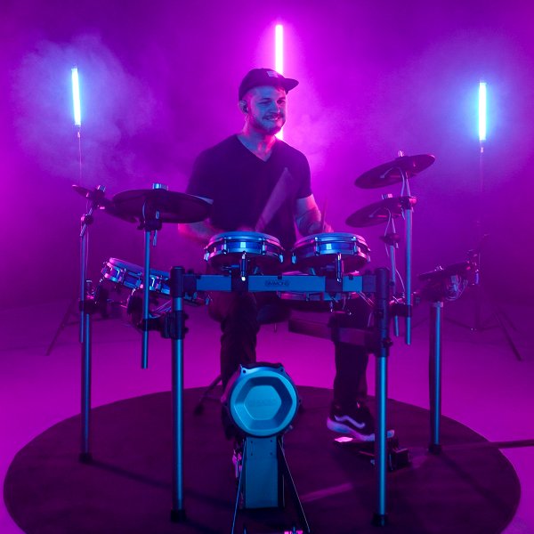 image of matt smiliing while playing the simmons titan 70 electronic drum kit