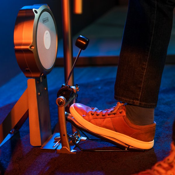 close up of drummer playing the bass kick on the simmons titan 70 electronic drum kit